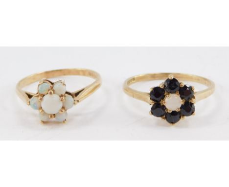 A 9ct gold and opal flower head ring, size M, and a 9ct gold and sapphire and opal flower head ring, size O/P, 3.8g. 