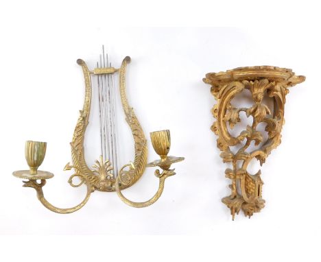 A Chinese Chippendale style gilt wood wall shelf, 22cm high, together with a brass lyre shaped twin branch candle wall light,