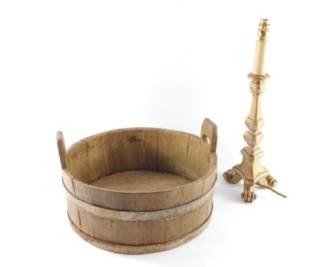 A 19thC coopered oak dairy tub, iron bound, 42cm diameter, together with a gold painted baroque style altar candlestick table