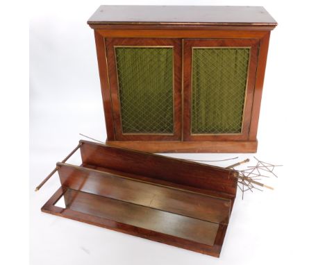 A Regency rosewood chiffonier, the brass galleried top over a mirrored back with single shelf, over a pair of doors with fabr