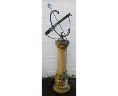 A brass armillary sundial, raised on a concrete column base, 140cm high. 
