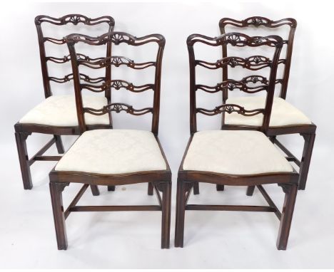 A set of four Chippendale style early 20thC mahogany ladder back single dining chairs, with drop-in seats, raised on channele
