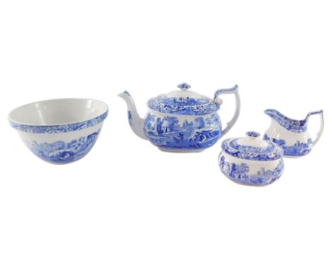 A Spode pottery blue and white teapot decorated in the Italian pattern, together with a cream jug and sucrier, and a mixing b