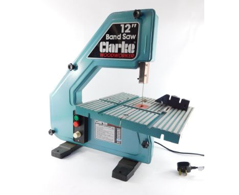 A Clarke Woodworker 12" electric band saw, Model BS-300.