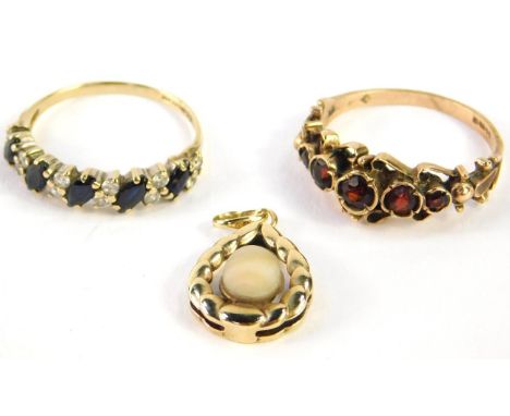 A 9ct gold and garnet five stone ring, size N, 9ct gold and sapphire five stone ring, set with pairs of zircons at intervals,