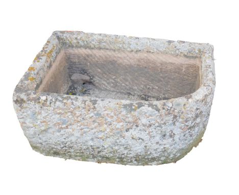 A hand hewn bull-nose stone trough, 38cm H, 87cm W, 56cm D.