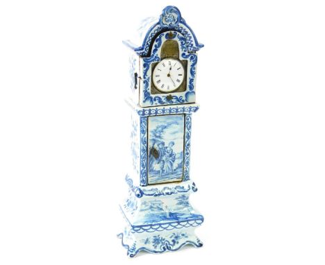 A Dutch Delft ware 19thC miniature longcase clock, the break arch dial with inset watch movement, enamel bearing Roman numera