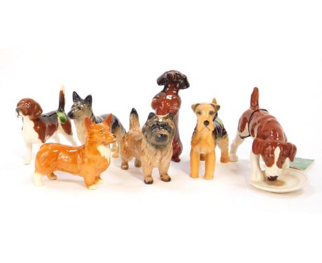 Seven Beswick terriers, beagle, corgi, and other dogs.