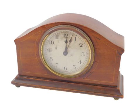 An Edwardian mahogany and boxwood line inlaid mantel clock, silvered dial bearing Arabic numerals, German movement, raised on