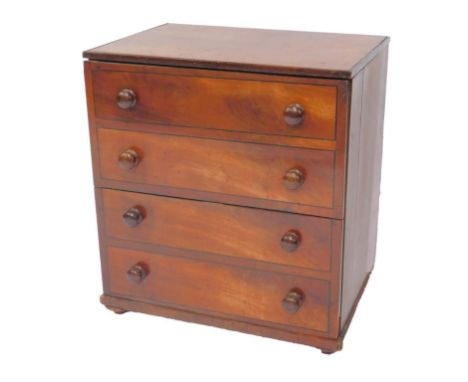 A George IV mahogany commode, with two doors, raised on a plinth base and turned feet, 67.5cm H, 62cm W, 44.5cm D.