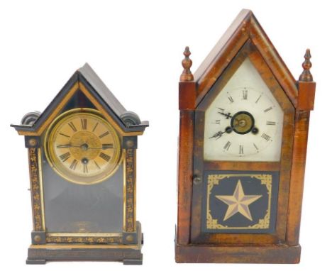 An America late 19thC walnut cased mantel clock, of Gothic architectural form, the tin dial bearing Roman numerals, eight day