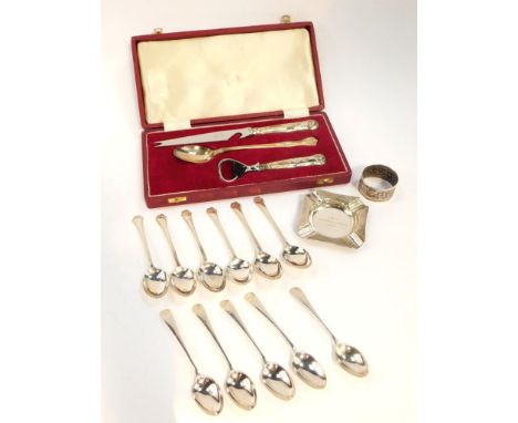 A set of six George V silver teaspoons, London 1929, four golfing teaspoons, Sheffield 1935, further spoon, napkin ring and a