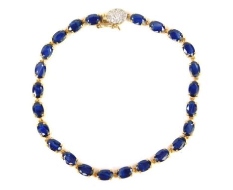 A 9ct gold and sapphire tennis bracelet, on a diamond set snap clasp, 18.5cm long, 5.9g.