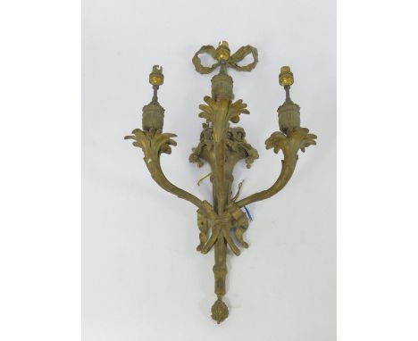 A French late 19thC ormolu three branch wall light, cast with a bow suspension and cornucopia of flowers, 55cm high.