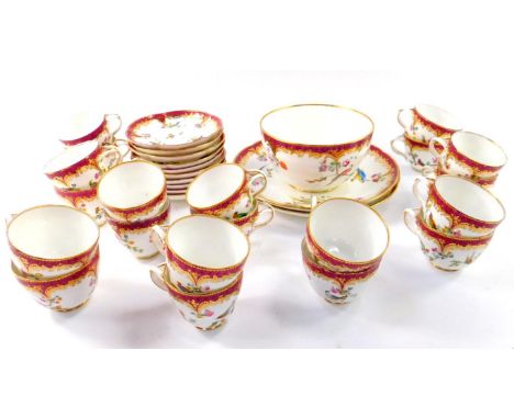 A mid 19thC porcelain part tea and coffee service, painted with birds butterflies and flowers, against a pink diaper and gilt