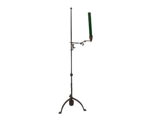 A Liberty style cast iron Arts & Crafts standard candle lamp, the tapering column with a single angular arm, raised on a weig