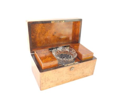 A Victorian burr walnut tea caddy, of rectangular section, the lid opening to reveal two tea cannisters, flanking a moulded g