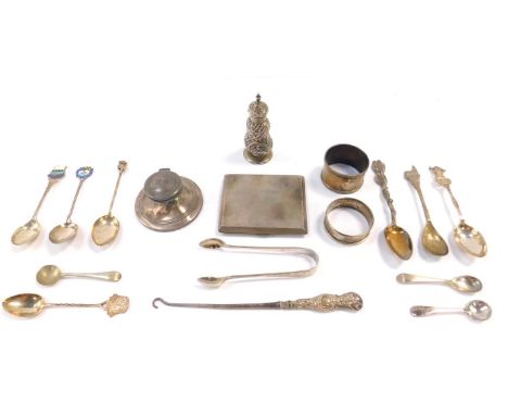 A Victorian silver pepperette, of baluster form with spiral fluted and embossed foliate decoration, Birmingham 1890, George V