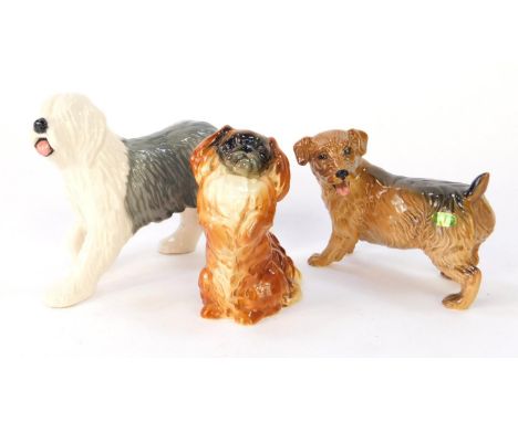 A Beswick figure of an Old English sheepdog, a terrier, and a seated Pekinese, 1059. (3).