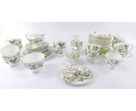 A Wedgwood porcelain part tea service decorated in the Wild Strawberry pattern, comprising eleven tea cups, nine saucers, and