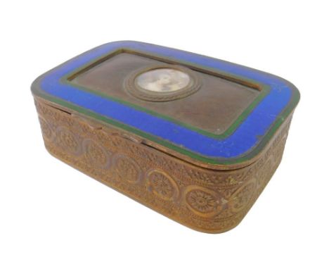 A Continental early 20thC brass casket, with a velvet interior, the hinged lid decorated centrally with a portrait of an eigh