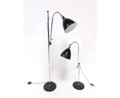 A metal and enamel 20thC angular standard lamp, and matching table lamp, 126cm high and 80cm high respectively. (2).