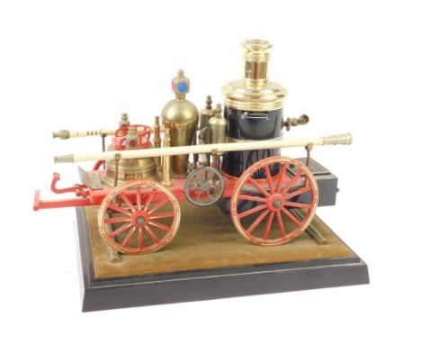 A novelty table lighter modelled as an 1869 Steam Fire Engine, 27cm long.