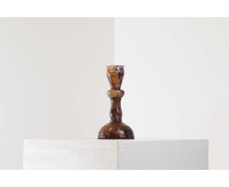 A Derbyshire Blue John candlestick,19th century, with a knopped column and a domed foot,17.5cm high Provenance: The personal 