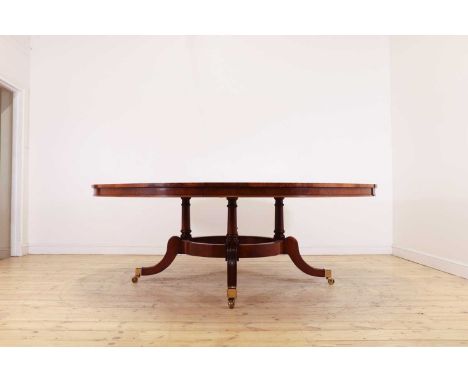 A Regency-style walnut extending dining table in the manner of Johnstone, Jupe &amp; Co.,first half of the 20th century, poss