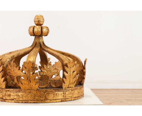 A large carved and giltwood architectural crown,20th century, the ball finial supported by eight arches and applied acanthus 