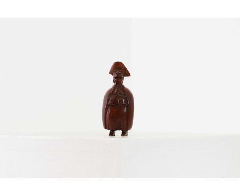A coquilla nut figural snuff box,late 18th century, Northern European, probably French, modelled as a gentleman with grotesqu