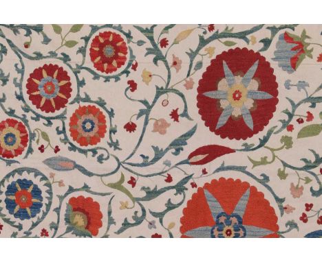 A suzani textile,of recent manufacture, Central Asian, Uzbekistan, silk embroidery on a calico ground, decorated to the centr
