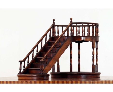 A turned wooden architectural model of a staircase,20th century, French, the single staircase leading to a circular balustrad