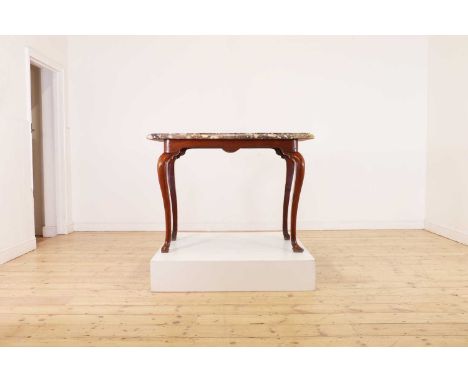 A walnut console table,18th century, the rectangular grey-veined marble top, above a shaped apron and carved cabriole legs, 1