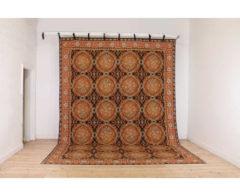 A flat-weave wool carpet of Aubusson design,late 20th century, the central field woven with floral motifs, within a foliate a