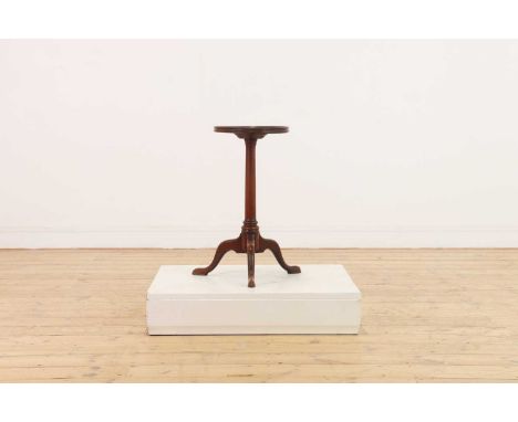 A George III mahogany kettle stand,with a dished top over a turned column and tripod base,top 27cm diameter54.5cm highConditi
