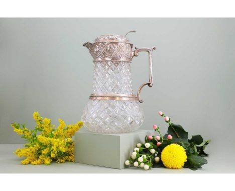 A silver-mounted cut-glass lemonade or water jug,by W &amp; G Sissons, Sheffield 1878,the cover and mount with pressed decora