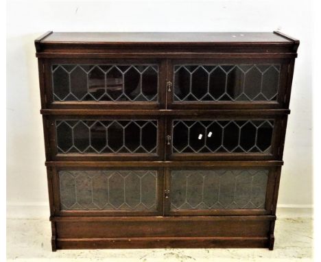Minty Mahogany Bookcase, lower plinth base with 3 leaded light sections over, hinged doors, caddy top