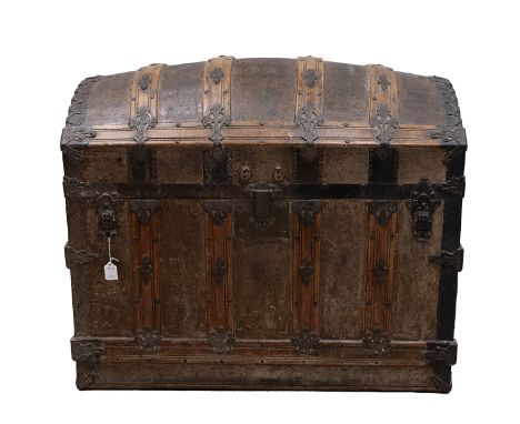 19th Century iron bound oak domed top trunk the leathered panelled lid opening to reveal a paper lined interior, fitted with 