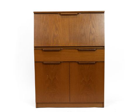 Mid century beech wood bureau with pull down writing slope opening to reveal an interior fitted with pigeon holes and shelves