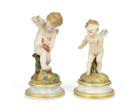 Meissen - two 19th century cupids, one piercing a heart with an arrow (broken) (20cm) and the other blindfolded (18cm) each o