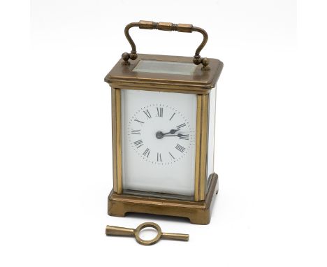 Late 19th or early 20th Century brass cased carriage clock of typical form with five glass panels. White enamel dial with Rom