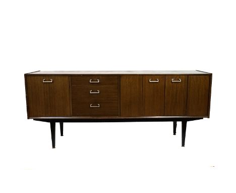 Mid Century Nathan sideboard in teak comprising drinks cabinet with drop down door, three drawers, the top one fitted for cut