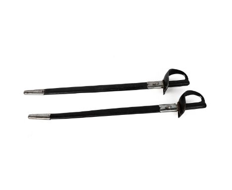 Royal Naval Interest: 2 x 1900 pattern Royal Naval cutlasses in black leather scabbards with white metal fittings. 'EFD' with