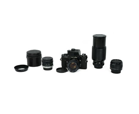 Minolta XM camera number 2127819 complete with four assorted lenses including a MD 2x TELE CONVERTER 300-S and a Vivitar seri