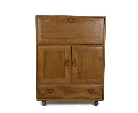 Mid century Ercol light elm bureau. Long drawer to base, cupboard to centre with adjustable shelf, drop flap space to top. On