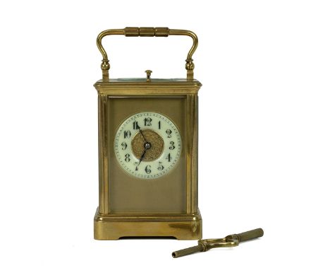 Repeater carriage clock in gilt brass case, the enamelled dial with Arabic numerals, and centre gilt disc with geometric rais