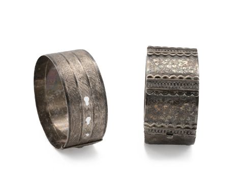 Two silver bangles one with engine turned decoration, maker: Charles Horner Chester 1946, 32.4g, and a bangle with half folia