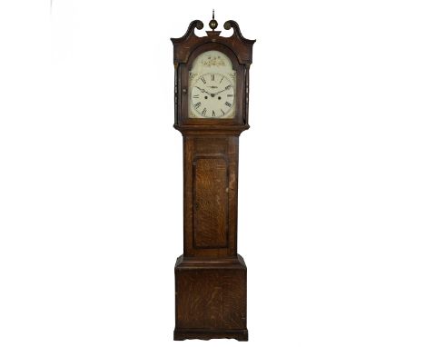 Early to mid 19th century eight day longcase clock in an oak cross banded case with lockable door. The broken arch scrolled p