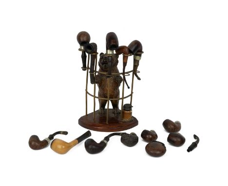 19th century German Black Forest pipe rack in the form of a standing bear, with various pipes.&nbsp;